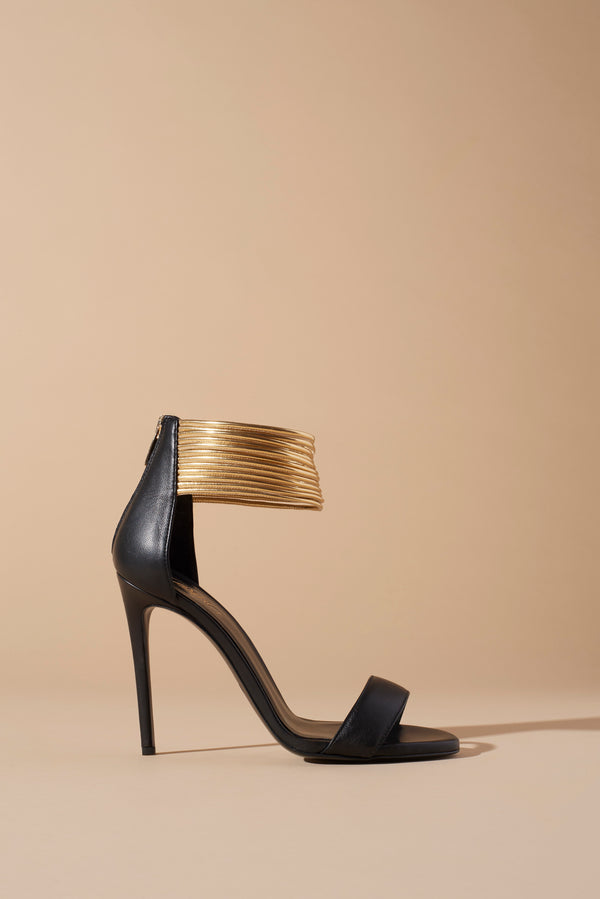 LEATHER SANDALS WITH STILETTO HEELS AND ANKLE STRAPS IN GOLD METAL LEATHER