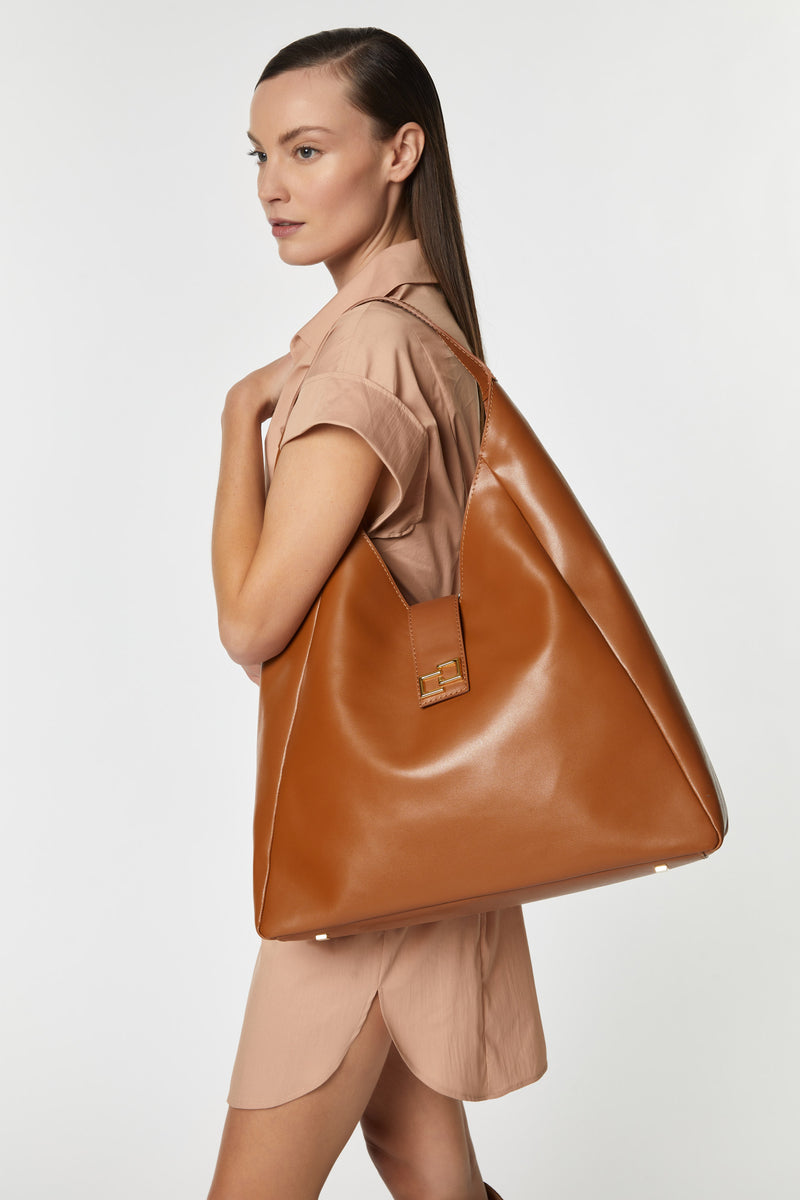LEATHER TRAPEZE BAG WITH GOLD CG LOGO