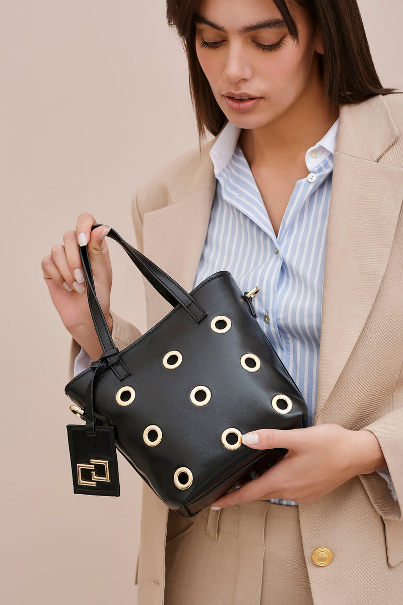 FAUX LEATHER FANCY BAG WITH METAL EYELETS